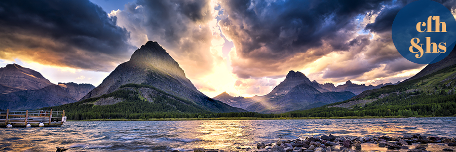 image of a sunset over Swiftcurrent Lake in Glacier National Park