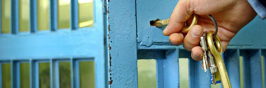 Image of guard unlocking cell